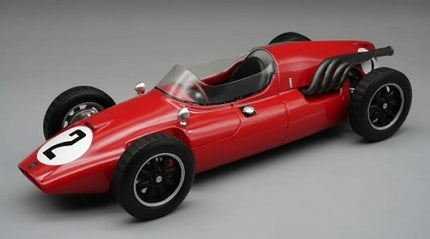 Red diecast model vintage race car with number 2, black wheels, exposed engine pipes