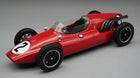 Red diecast model vintage race car with number 2, black wheels, exposed engine pipes