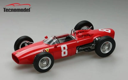 Red diecast vintage Formula 1 model car with number 8, Tecnomodel logo visible