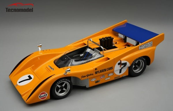 1:18 scale orange vintage McLaren race car diecast model with detailed decals and blue rear wing