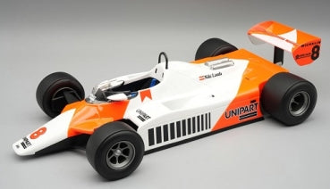 1:18 scale diecast model of a vintage white and orange Formula 1 race car with Unipart livery