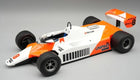 1:18 scale diecast model of a classic orange and white Formula 1 race car with Unipart livery