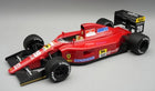 Red 1:18 scale diecast Formula 1 race car model with sponsor decals and detailed cockpit