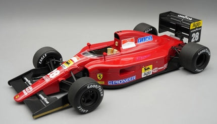 Diecast 1:18 scale red Ferrari Formula 1 model car with authentic sponsor decals and racing details.