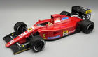 1:18 scale red Ferrari Formula 1 diecast model car with racing decals and black wing.