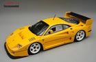 Yellow Ferrari F40 1:18 scale diecast model car with white wheels and black spoiler