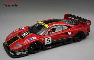 Red 1:18 scale diecast race car model with black and yellow accents and racing decals