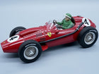 1:18 scale red vintage Ferrari race car diecast model with driver figure and number 4 decals