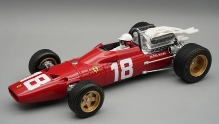 Red diecast model Formula 1 race car with number 18, gold wheels, and detailed engine.