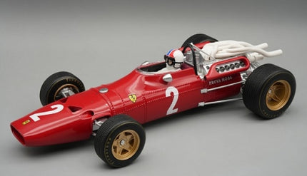Red 1:18 scale diecast classic Formula 1 model car with gold wheels and detailed engine
