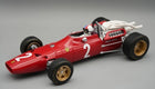 Red 1:18 scale diecast classic Formula 1 model car with gold wheels and detailed engine