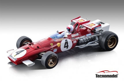 Red 1:18 scale Ferrari Formula 1 diecast model car with driver figure and race decals