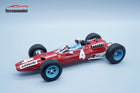 Red diecast model Formula 1 race car with number 4 and blue wheels on a light background