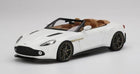 White convertible diecast model car with tan interior, 1:18 scale, on white background