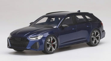 1:18 scale blue diecast model car wagon with black roof and sporty rims on white background