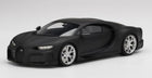 Matte black diecast model sports car with silver wheels, 1:18 scale, on white background