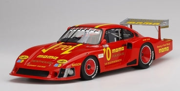 Red diecast race car model with yellow decals, detailed spoiler, and black wheels