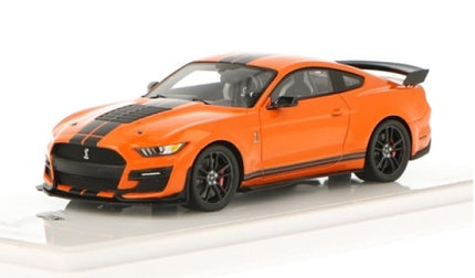 Orange diecast model car with black racing stripes and spoiler, 1:18 scale sports car.
