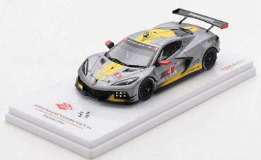 1:64 scale gray and yellow diecast race car model with black spoiler on display stand
