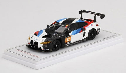 1:43 scale BMW race car diecast model with M livery on display stand
