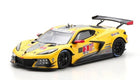 Yellow diecast racing car model with black accents, rear wing, and sponsor decals