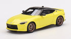 1:18 scale diecast yellow sports car model with black roof and bronze wheels
