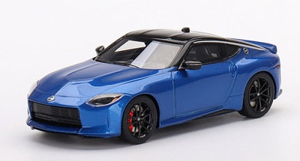 1:18 scale blue diecast sports car model with black roof and red brake calipers