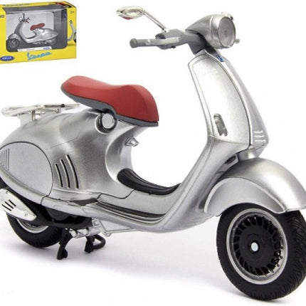 Silver diecast Vespa scooter model with red seat, 1:18 scale, collectible in box