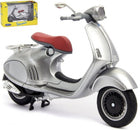 Silver diecast Vespa scooter model with red seat, 1:18 scale, collectible in box
