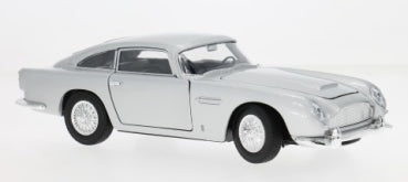 Silver 1:24 scale classic diecast model car with detailed body and wheels on white background