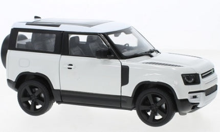 white 1:24 scale diecast SUV model car with black roof and wheels, side view