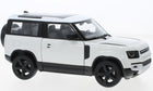 white 1:24 scale diecast SUV model car with black roof and wheels, side view