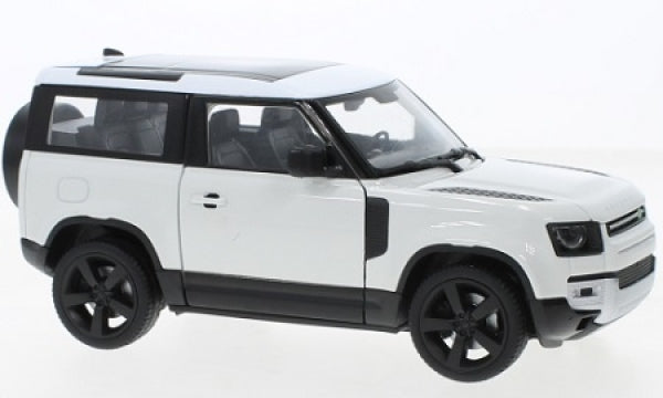 white 1:24 scale diecast SUV model car with black roof and wheels, side view