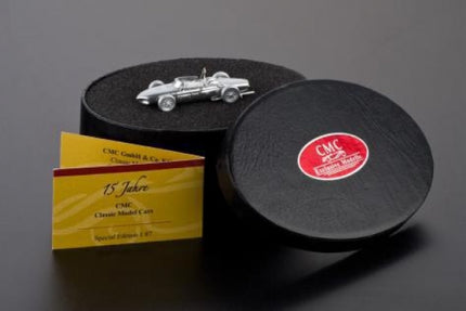 Silver diecast model car in display case with certificate, classic car collectible 1:87 scale