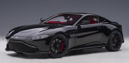 1:18 scale diecast model car in jet black, front view, sleek sports coupe with red interior