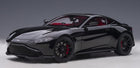 1:18 scale diecast model car in jet black, front view, sleek sports coupe with red interior