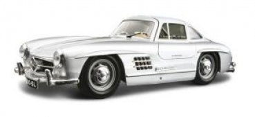 Silver classic diecast model car in 1:18 scale with detailed features against white background