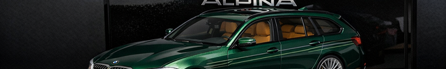 1:18 scale green BMW Alpina B3 diecast model car on luxury display stand