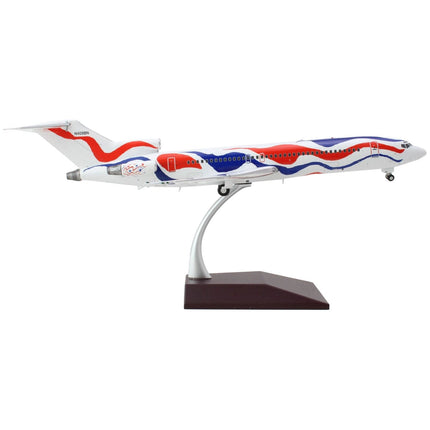 https://cdn.shopify.com/s/files/1/0504/9925/6496/products/boeing-727-200-commercial-aircraft-braniff-international-airways-calder-bicentennial-livery-white-with-red-and-blue-stripes-gemini-200-series-1200-diecast-model-514112.jpg?v=1748420458