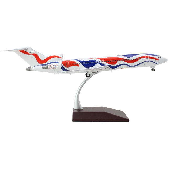 https://cdn.shopify.com/s/files/1/0504/9925/6496/products/boeing-727-200-commercial-aircraft-braniff-international-airways-calder-bicentennial-livery-white-with-red-and-blue-stripes-gemini-200-series-1200-diecast-model-514112.jpg?v=1748420458