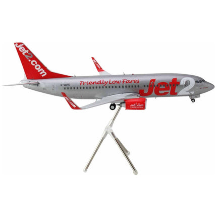 https://cdn.shopify.com/s/files/1/0504/9925/6496/files/boeing-737-300-commercial-aircraft-jet2-g-gdfg-gray-metallic-with-red-tail-gemini-200-series-1200-diecast-model-airplane-by-geminijets-811836.jpg?v=1748405395