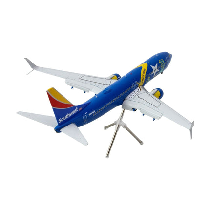 https://cdn.shopify.com/s/files/1/0504/9925/6496/files/boeing-737-800-commercial-aircraft-with-flaps-down-southwest-airlines-nevada-one-n8646b-blue-with-tail-stripes-gemini-200-series-1200-diecast-model-airplane-by--639858.jpg?v=1748405263
