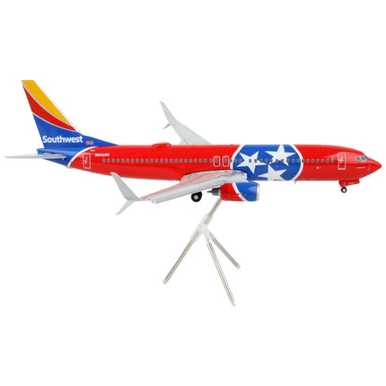 https://cdn.shopify.com/s/files/1/0504/9925/6496/products/boeing-737-800-commercial-aircraft-with-flaps-down-southwest-airlines-tennessee-one-tennessee-flag-livery-gemini-200-series-1200-diecast-model-airplane-by-gemin-717428.jpg?v=1748420742