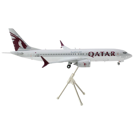 https://cdn.shopify.com/s/files/1/0504/9925/6496/products/boeing-737-max-8-commercial-aircraft-qatar-airways-gray-and-white-with-tail-graphics-gemini-200-series-1200-diecast-model-airplane-by-geminijets-929356.jpg?v=1748420539