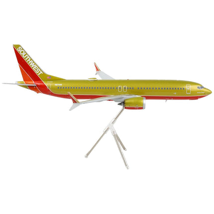 https://cdn.shopify.com/s/files/1/0504/9925/6496/products/boeing-737-max-8-commercial-aircraft-southwest-airlines-gold-and-red-gemini-200-series-1200-diecast-model-airplane-by-geminijets-511519.jpg?v=1748420744