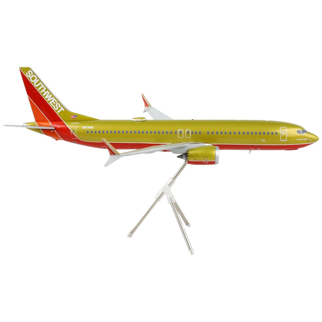 https://cdn.shopify.com/s/files/1/0504/9925/6496/products/boeing-737-max-8-commercial-aircraft-southwest-airlines-gold-and-red-gemini-200-series-1200-diecast-model-airplane-by-geminijets-511519.jpg?v=1748420744