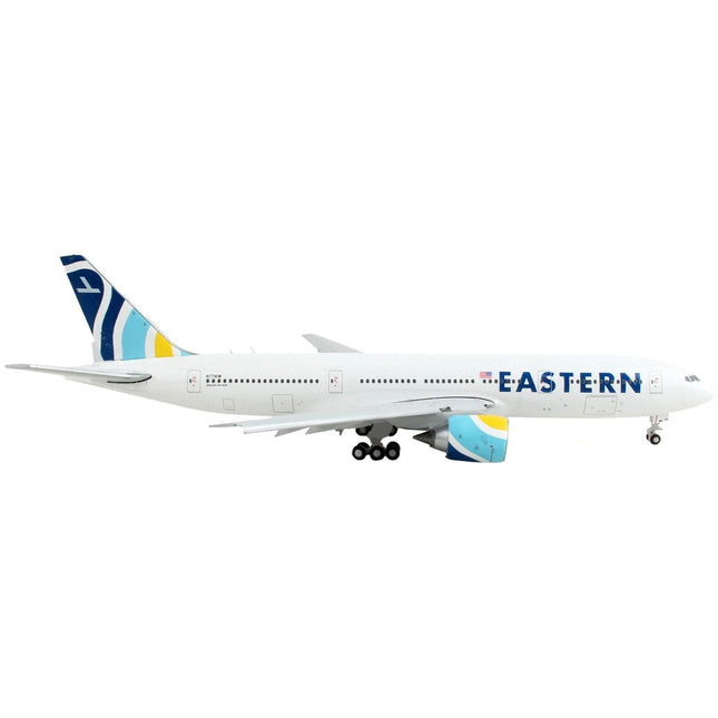 https://cdn.shopify.com/s/files/1/0504/9925/6496/products/boeing-777-200er-commercial-aircraft-with-flaps-down-eastern-air-lines-white-with-striped-tail-1400-diecast-model-airplane-by-geminijets-907610.jpg?v=1748420745