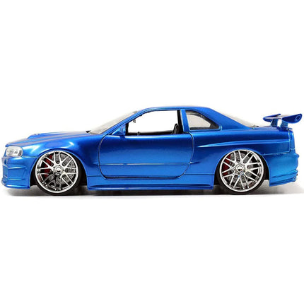 https://cdn.shopify.com/s/files/1/0504/9925/6496/files/brians-nissan-gtr-skyline-r34-rhd-right-hand-drive-blue-fast-furious-movie-124-diecast-model-car-by-jada-167841.jpg?v=1748419006
