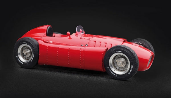 Red diecast model classic race car with detailed wheels, 1:18 scale, on black background