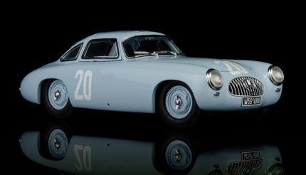 Light blue diecast vintage race car model with number 20, displayed on black background
